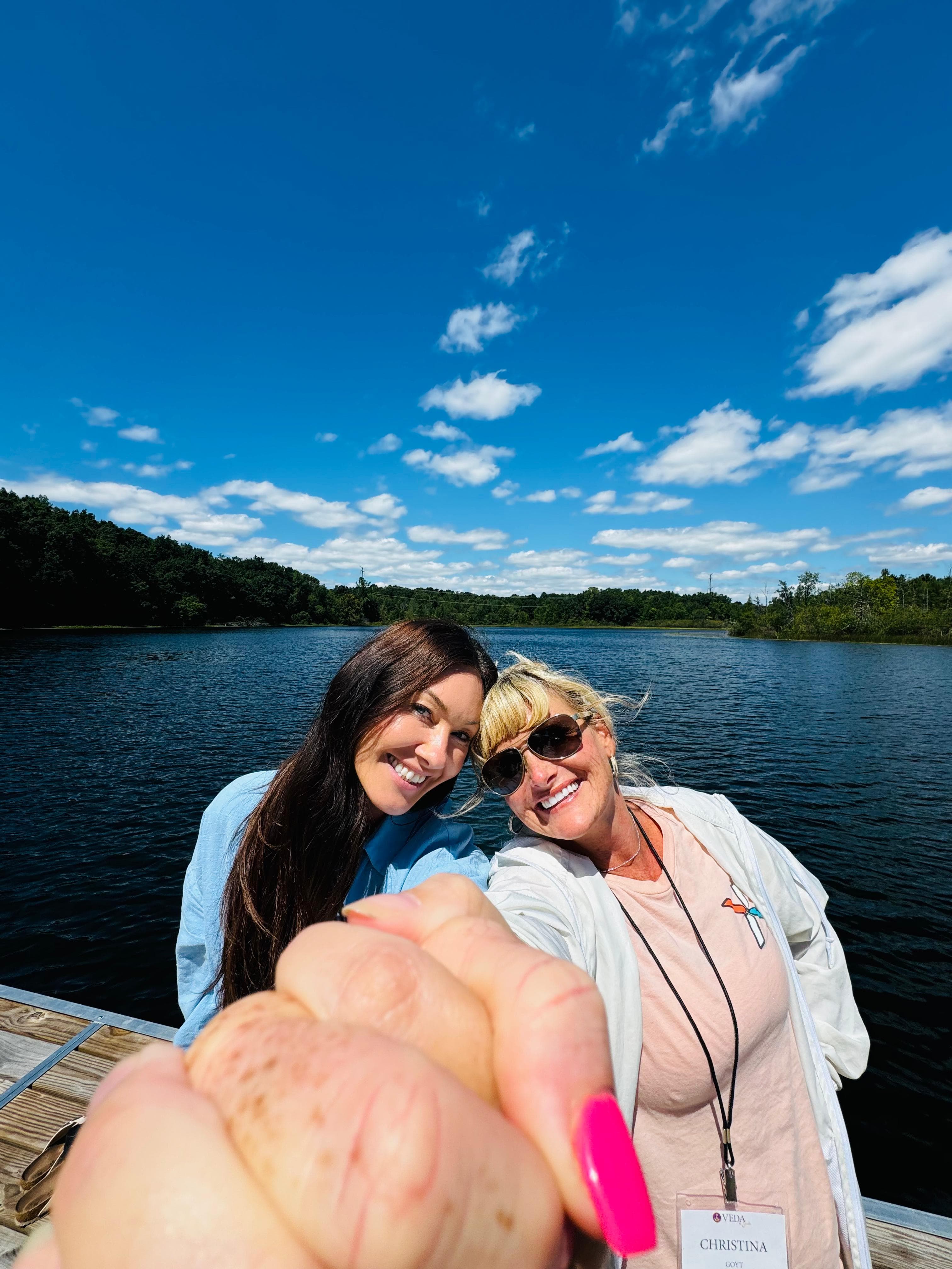 Sisters by the lake — sunshine, blue sky, easy joy