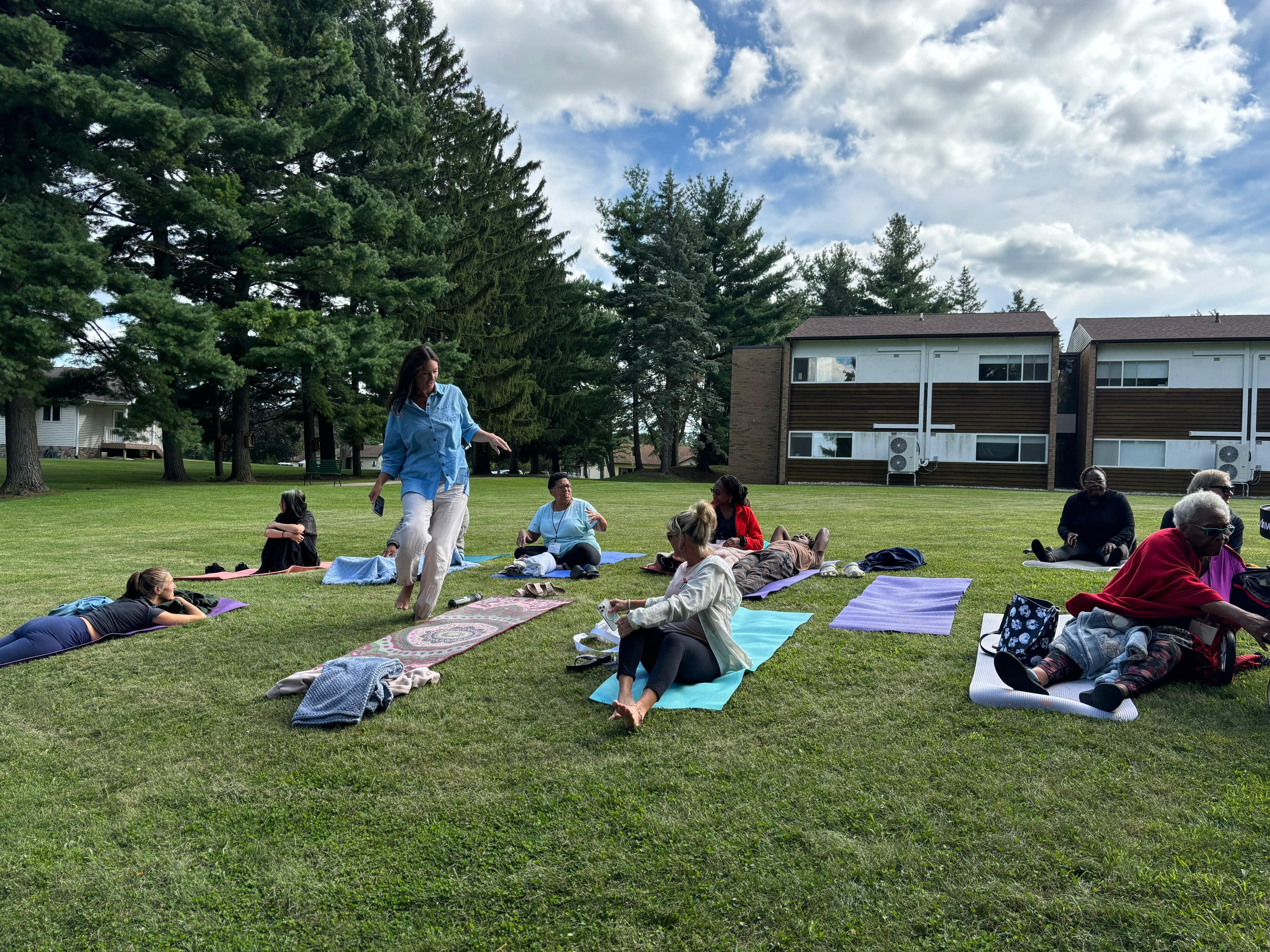 Guided yoga nidra — the room held in lantern light, bodies at rest